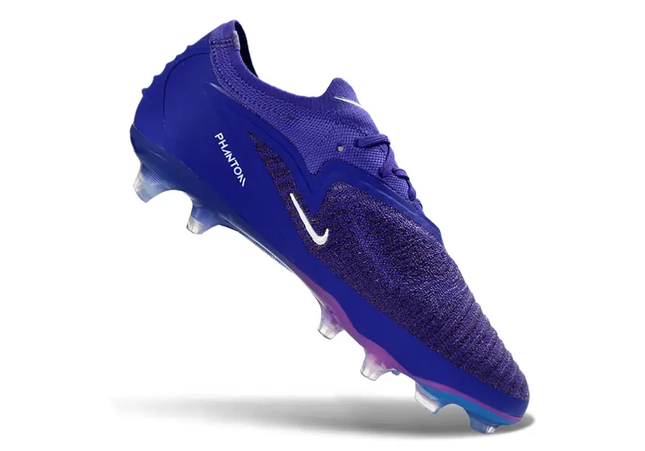 Nike Phantom 6 Elite Firm Ground Football Boots for Men on green grass by Nike